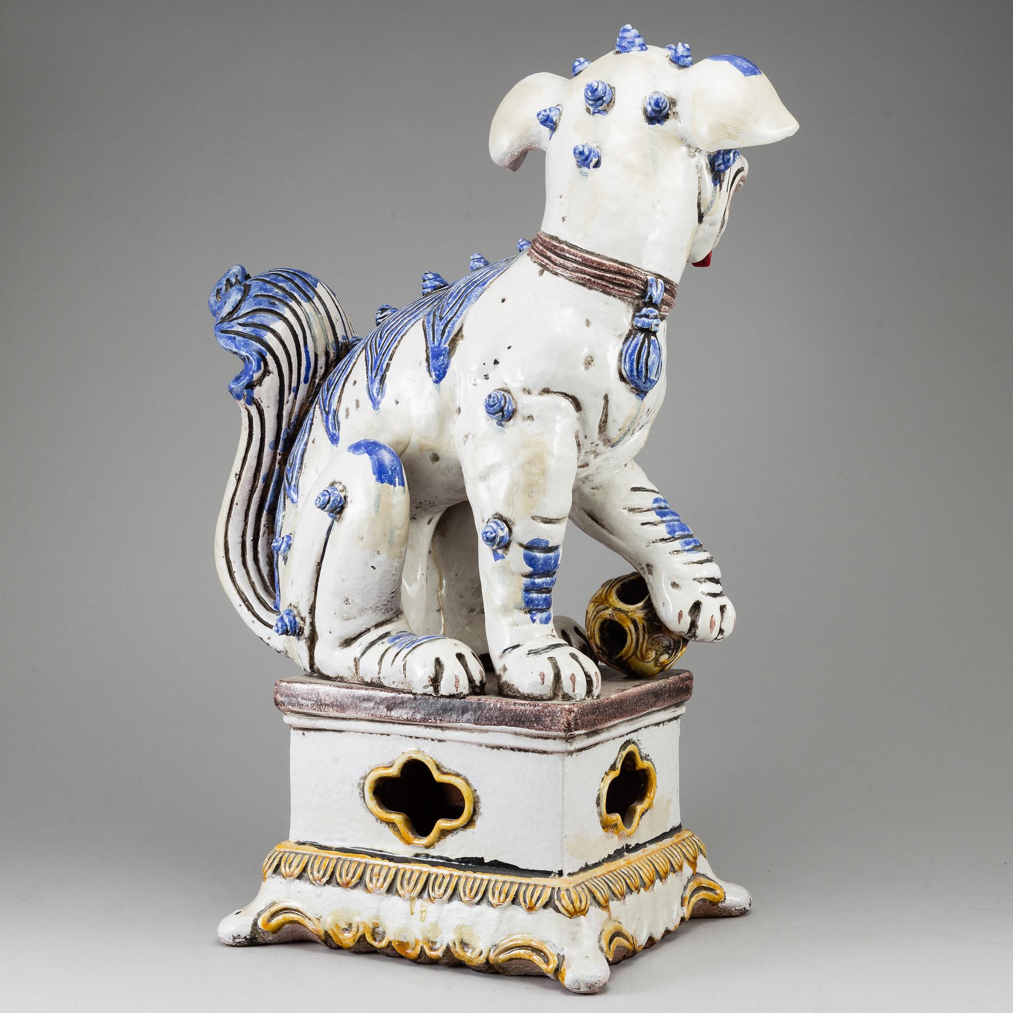 A large Chinese ceramic tile sculpture of a buddhist lion, 20th century.