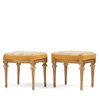 86. A pair of giltwood stools by E. Ståhl (master in Stockholm 1794-1820).