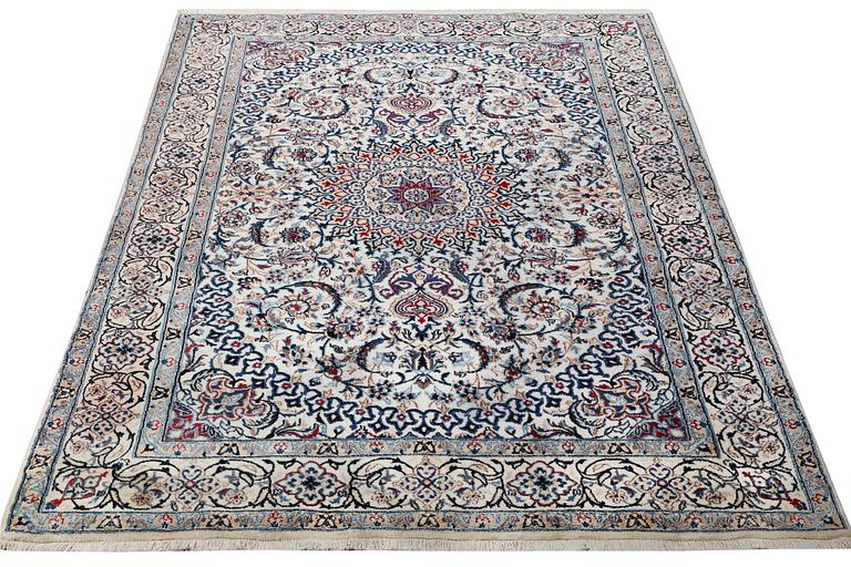 A Nain carpet, part silk, 9 laa, c. 293 x 199 cm.