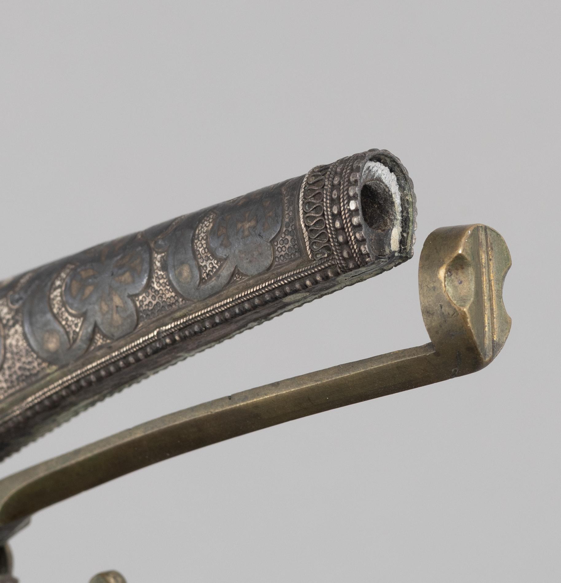 A Caucasian priming flask.