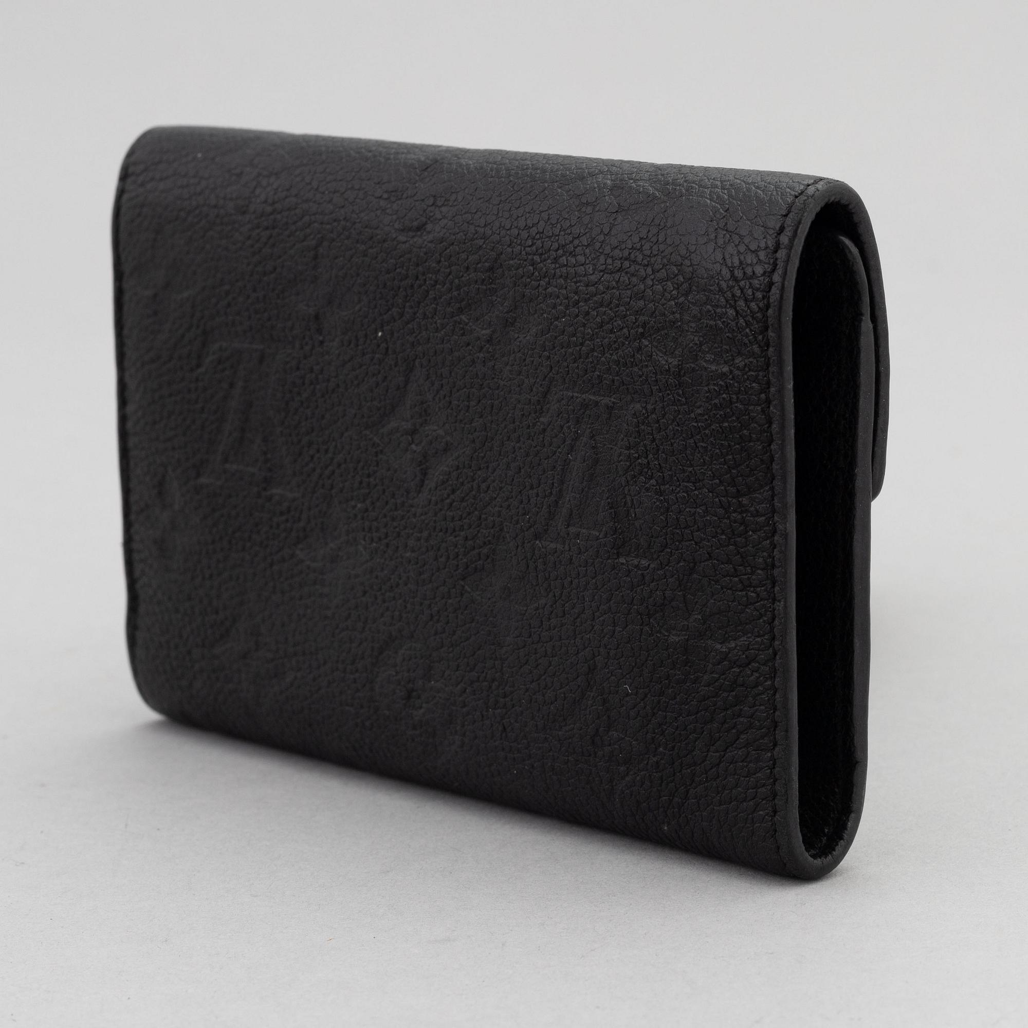 Louis Vuitton, a black Monogram Empreinte leather 'Curieuse' wallet, 2015.