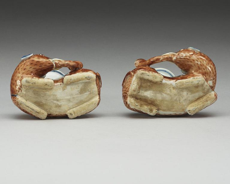 A pair of Export candle sticks in the shape of reclining elephants, Qing dynasty, Qianlong (1736-95).