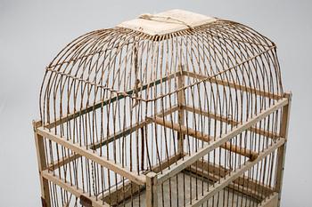 A bird cage from around the year of 1900.