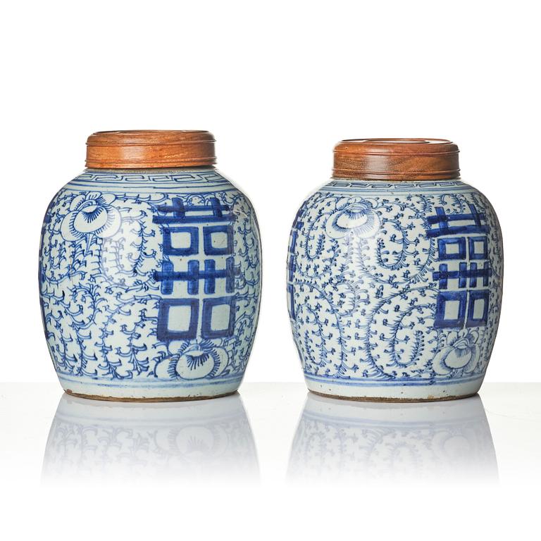 A pair of blue and white porcelain pots with covers, China, 19th century.