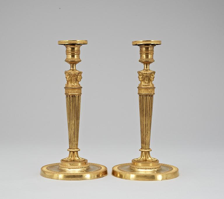 A pair of French Empire early 19th Century candlesticks.