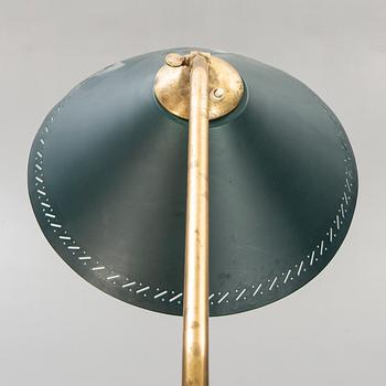 A 1950s brass floor lamp.