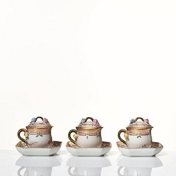 A set of 12 Royal Copenhagen 'Flora Danica' custard cups with covers and stands, Denmark, 20th Century.