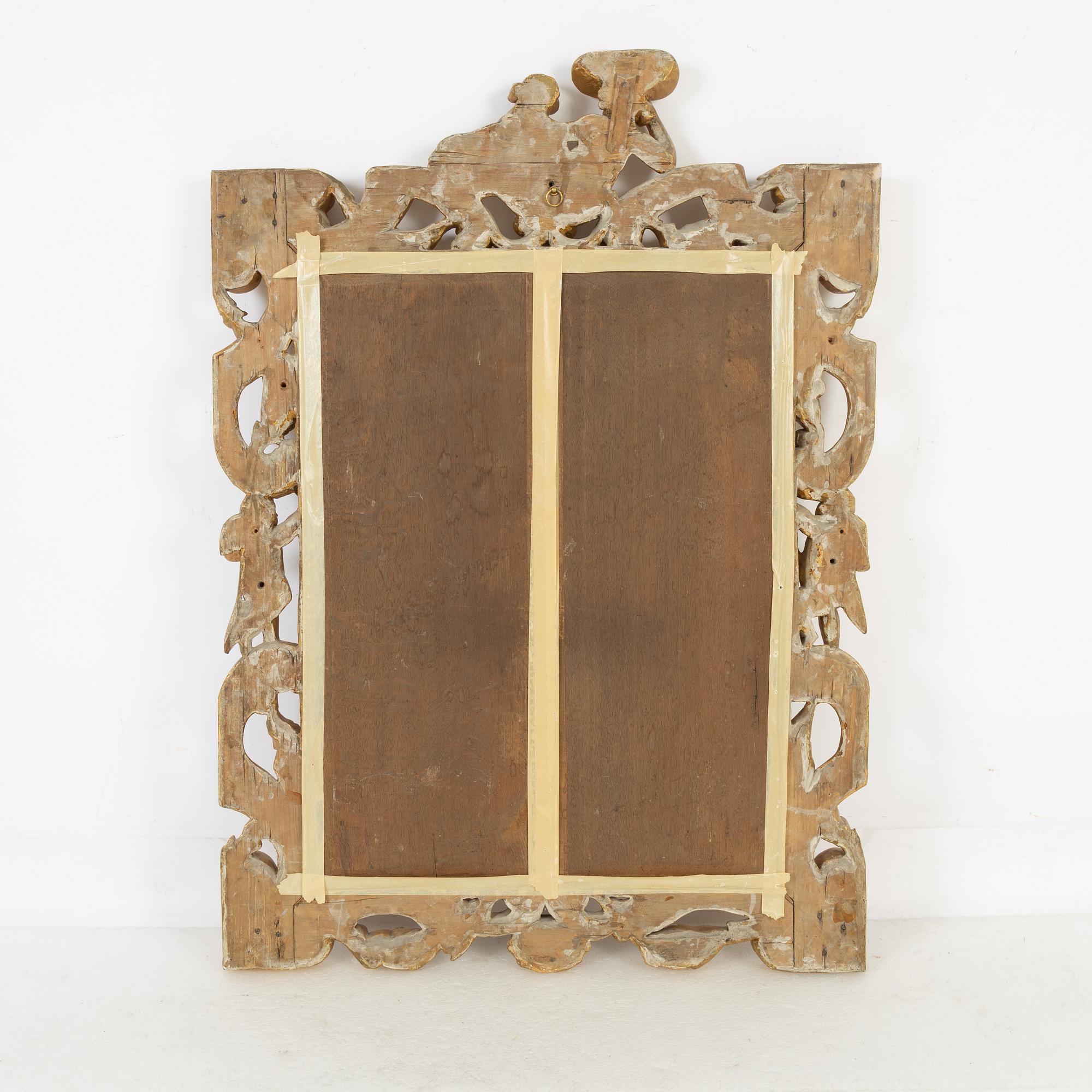 A gilt Baroque style mirror, circa 1900.