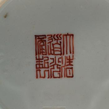 A famille rose bowl, late Qing dynasty, with Daoguangs sealmark in red.