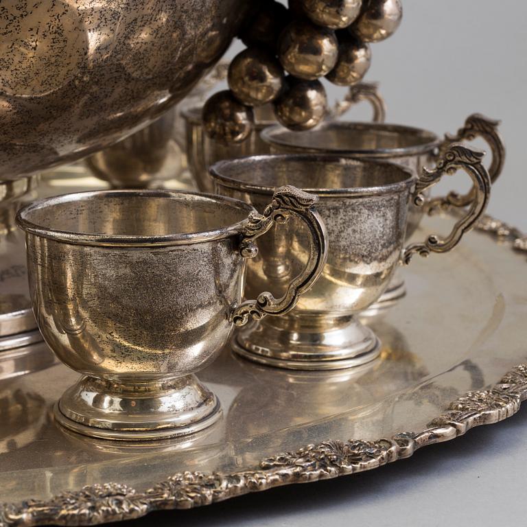 A first half of the 20th century silver punch bowl with twelve cups.