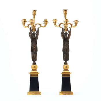 A pair of French Empire early 19th century four-light candelabra.