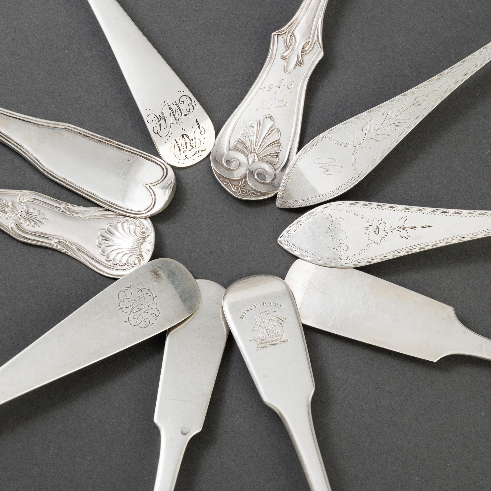 A set of 10 different spoons of different nationalities.