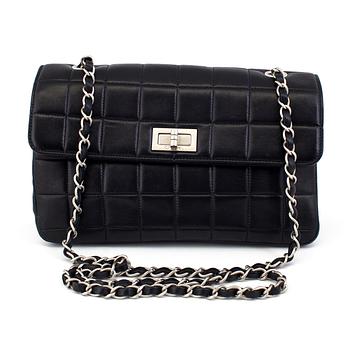 A bag CHOCOLATE BAR REISSUE by Chanel.