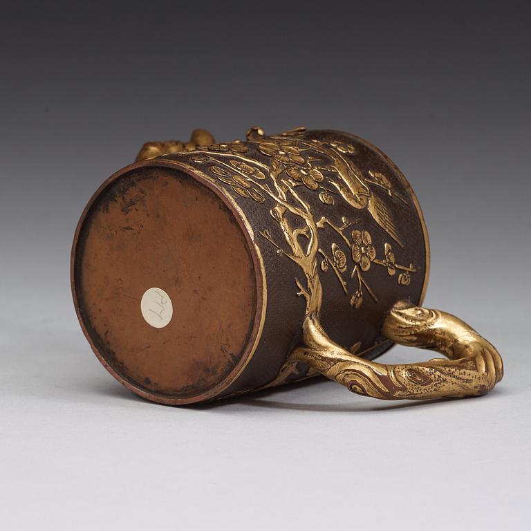 A gilt copper alloy teapot with cover, Qing dynasty, presumably 18th Century.