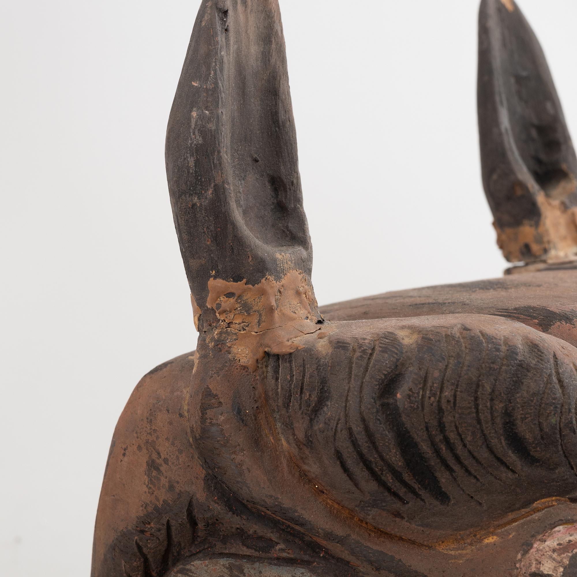 Four Tibetan/South East Asian wooden decorations, 20th century.