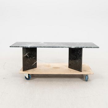 A marble coffee table alter part of the 20th century/21st century.