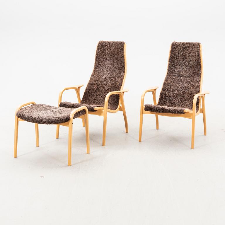 Yngve Ekström, a pair of beech 'Lamino' shearling upholstered lounge chairs and one foot stool from Swedese.