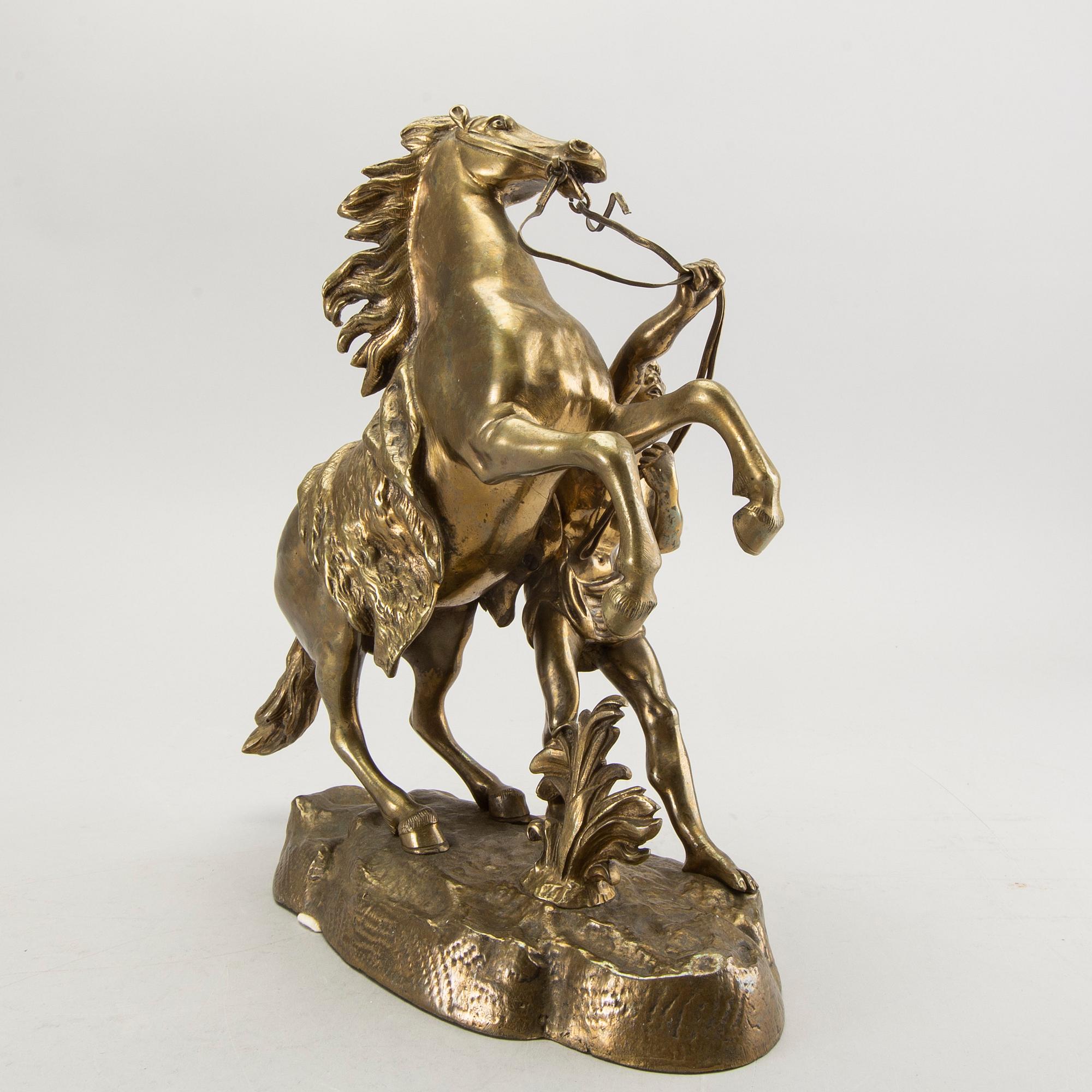 A bronze sculpture after Guillaume Coustau.