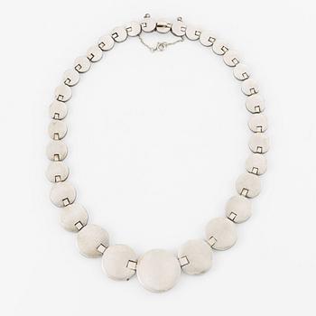 A silver necklace.