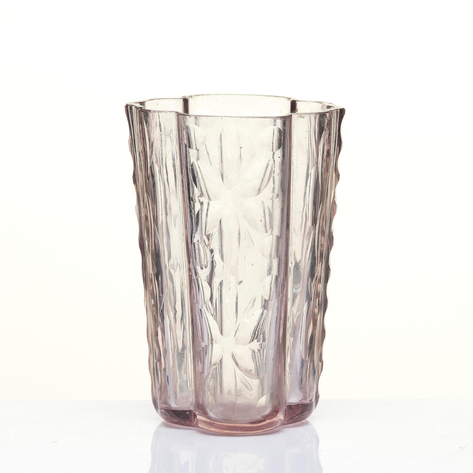 An amethyst coloured suger shaker and a cut glass goblet, 18th century.