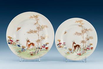1386. A set of six famille rose dinner plates and a serving dish, Qing dynasty, Qianlong (1736-95). (7).