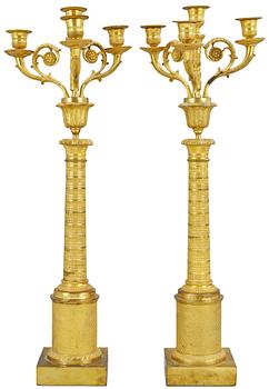 945. A French Empire four-light candelabra.