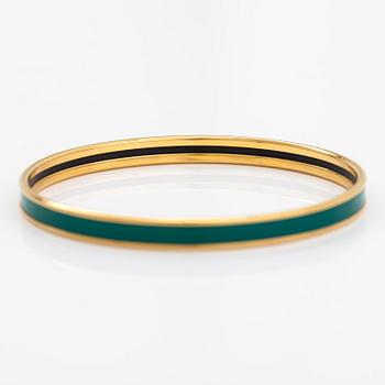 Hermès, a bracelet made of gold coloured metal and green enamel. Marked Hermès Paris, Made in France.