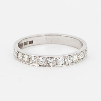 Brilliant-cut diamond half-eternity ring.