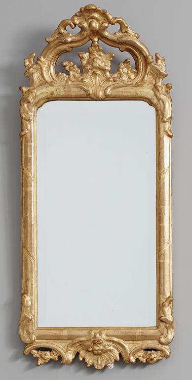 A rococo mirror, 18th Century.