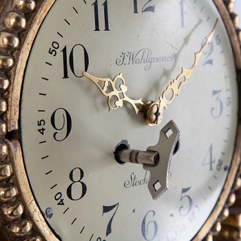 A 20th century gustavian style wall clock.