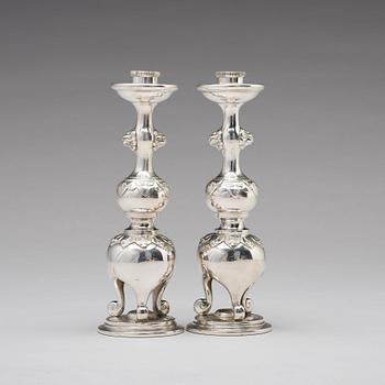 A pair of Chinese silver candle sticks, Shanghai, early 20th Century.