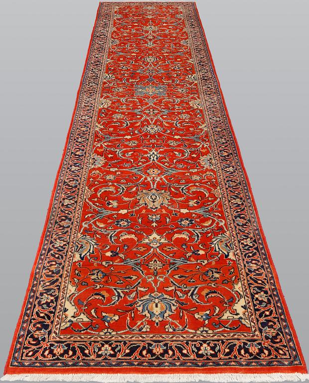 A Sarouk runner, 410 x 80 cm.