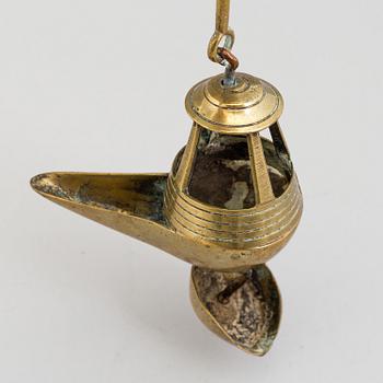 A 18th century bronze oil lamp.