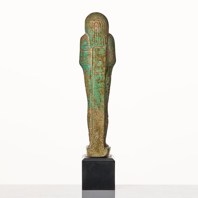 A light green pottery Ushabti Egypt presumably 26:e dynasty ca 650 B.C.