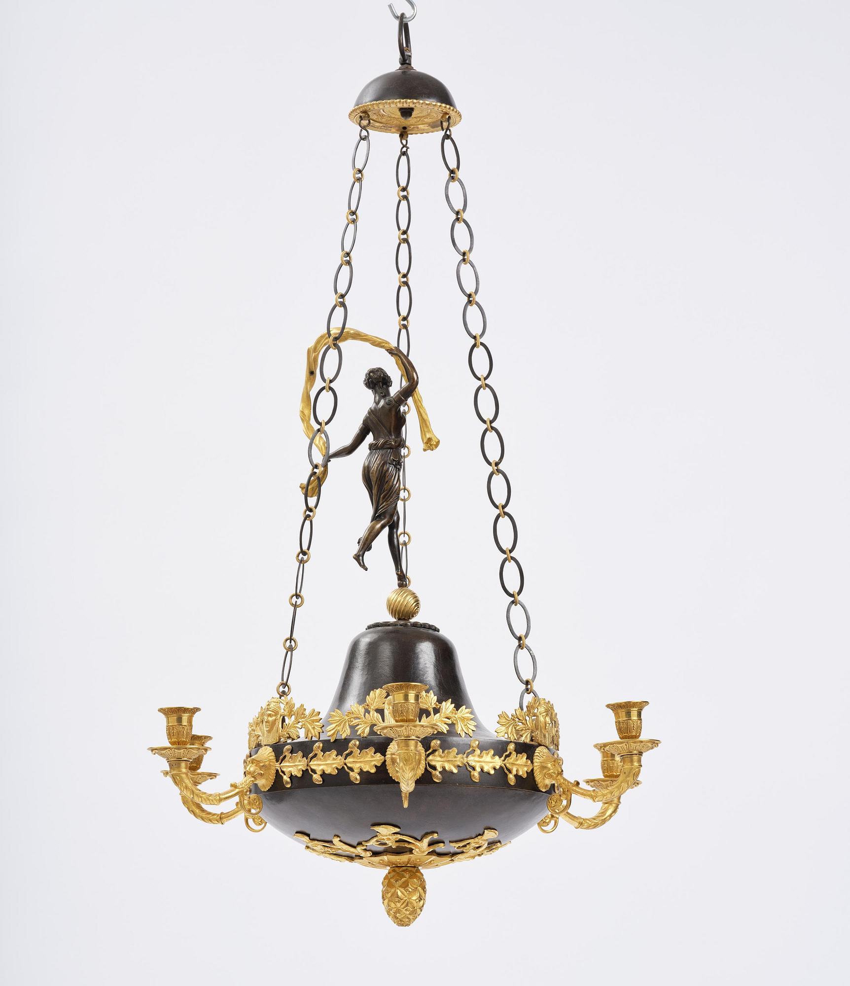 A patinated and ormolu six-light Empire chandelier, Stockholm, first part 19th century.