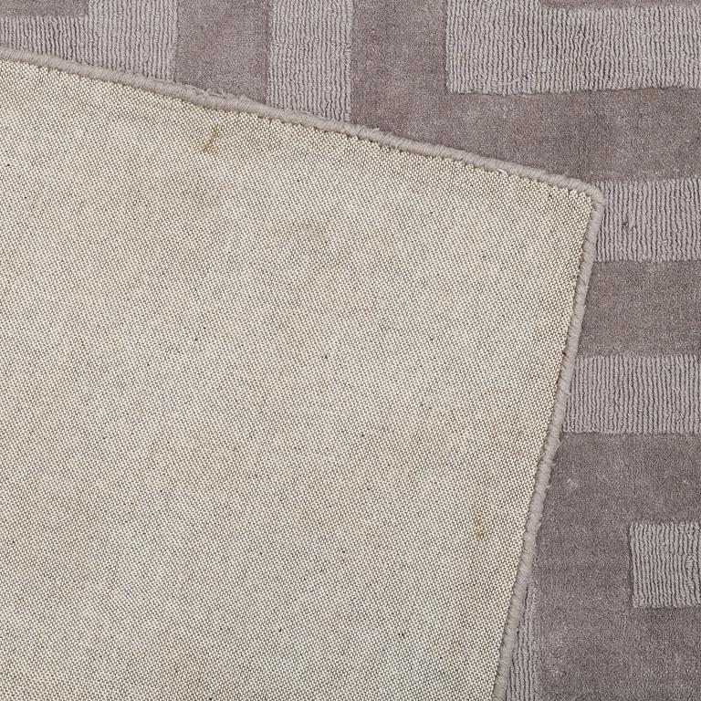A Layered "Wool Cubes" carpet, 390x620 cm.