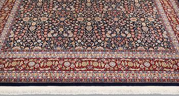 A signed Hereke carpet, ca 340 x 246 cm.
