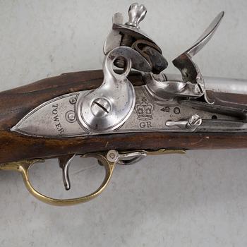 A flintlock rifle from Tower, England, around the year 1800.