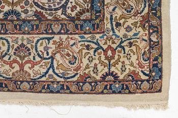 A Tabriz carpet, semi-antique, c. 330 x 230 cm.