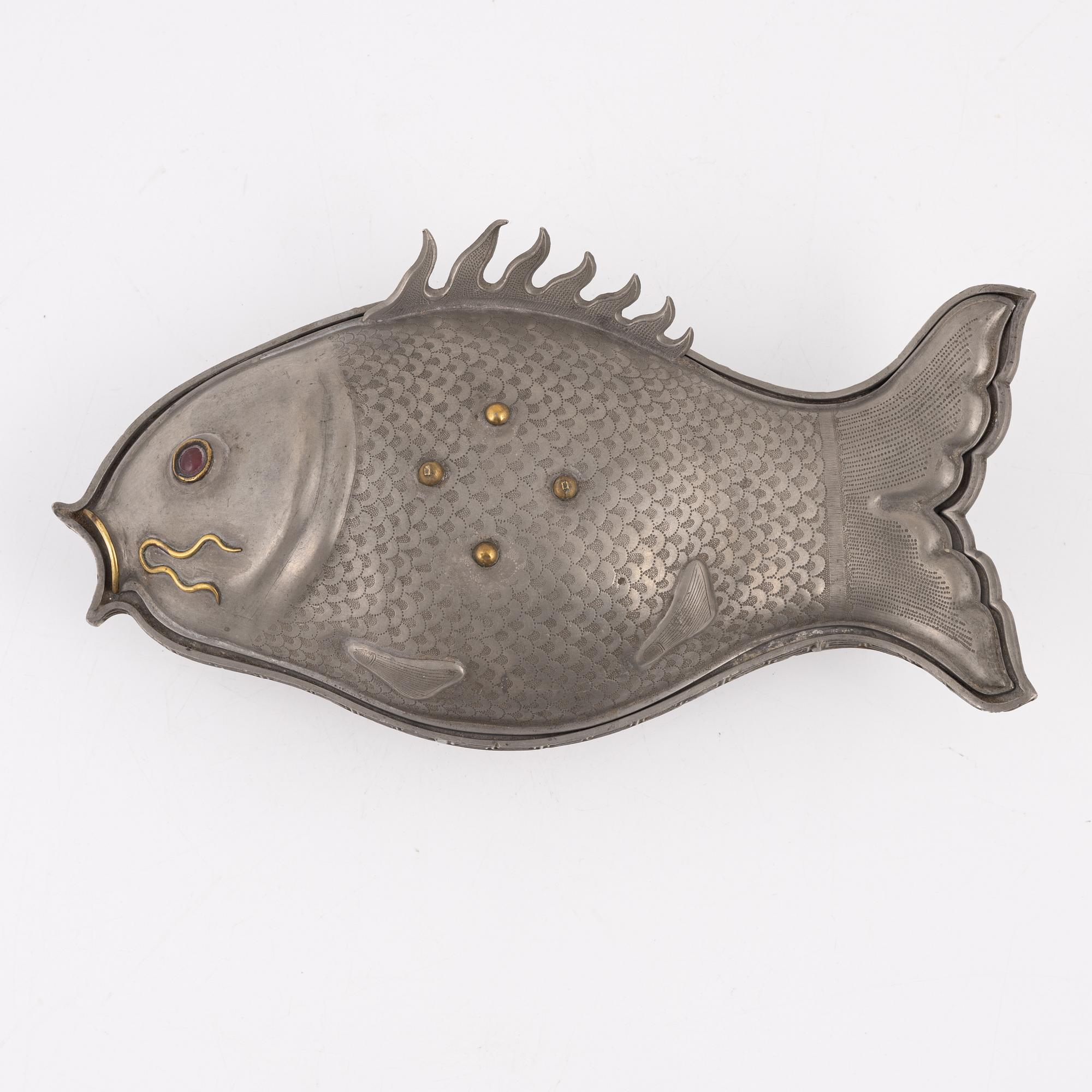 A pewter jelly mould with lid.