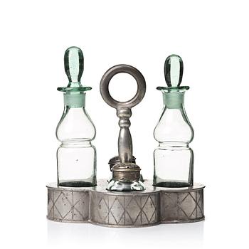 239. Nils Fougstedt, a pewter and glass cruet-set, Svenskt Tenn, Stockholm 1925, model 163.