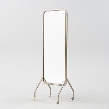 A mid 20th Century floor mirror on wheels.