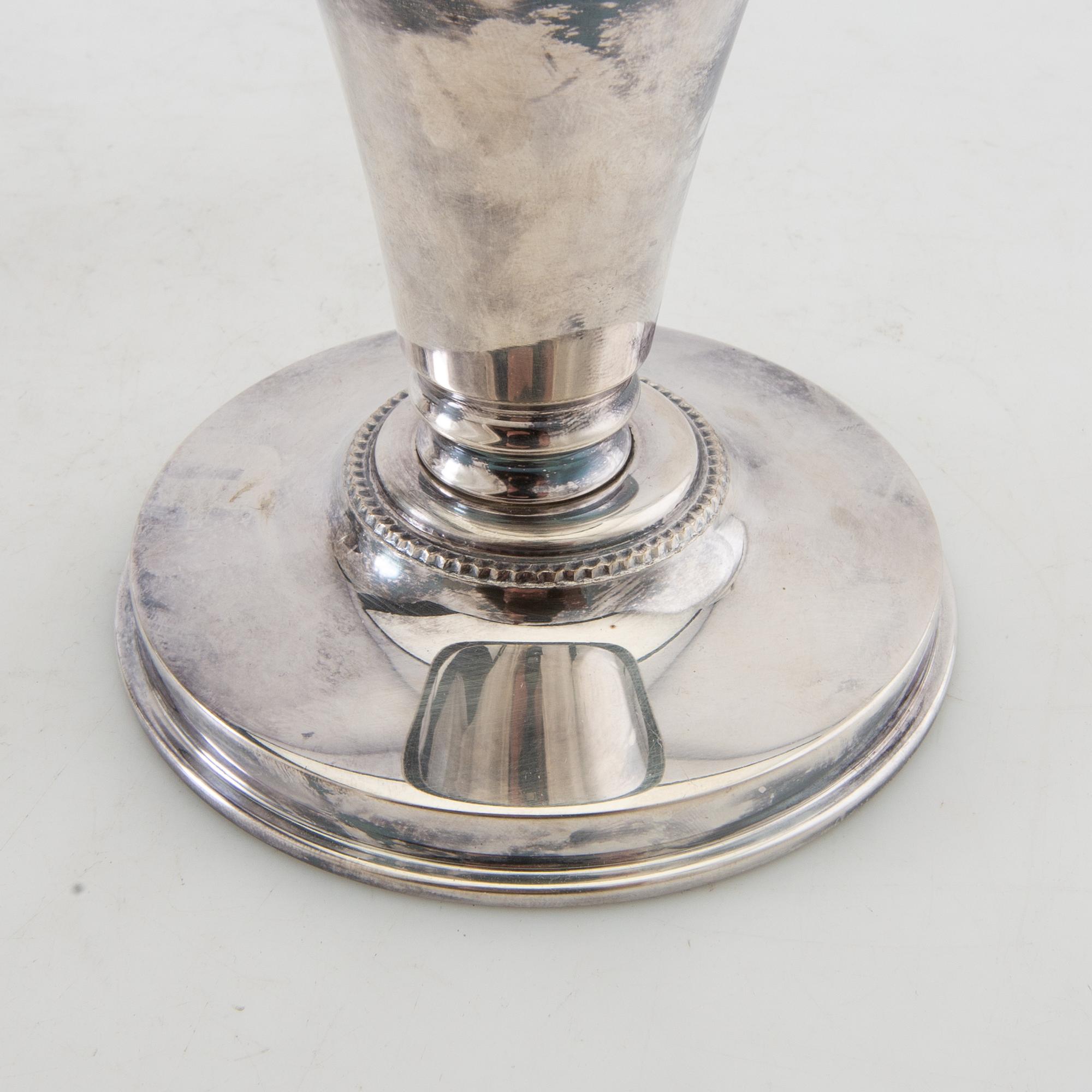 Candelsticks, a pair of silver-plated metal, first half of the 20th century.