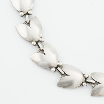 Georg Jensen, a necklace and a pair of "Tulip" earrings no. 66 and no. 106, sterling silver, Denmark.