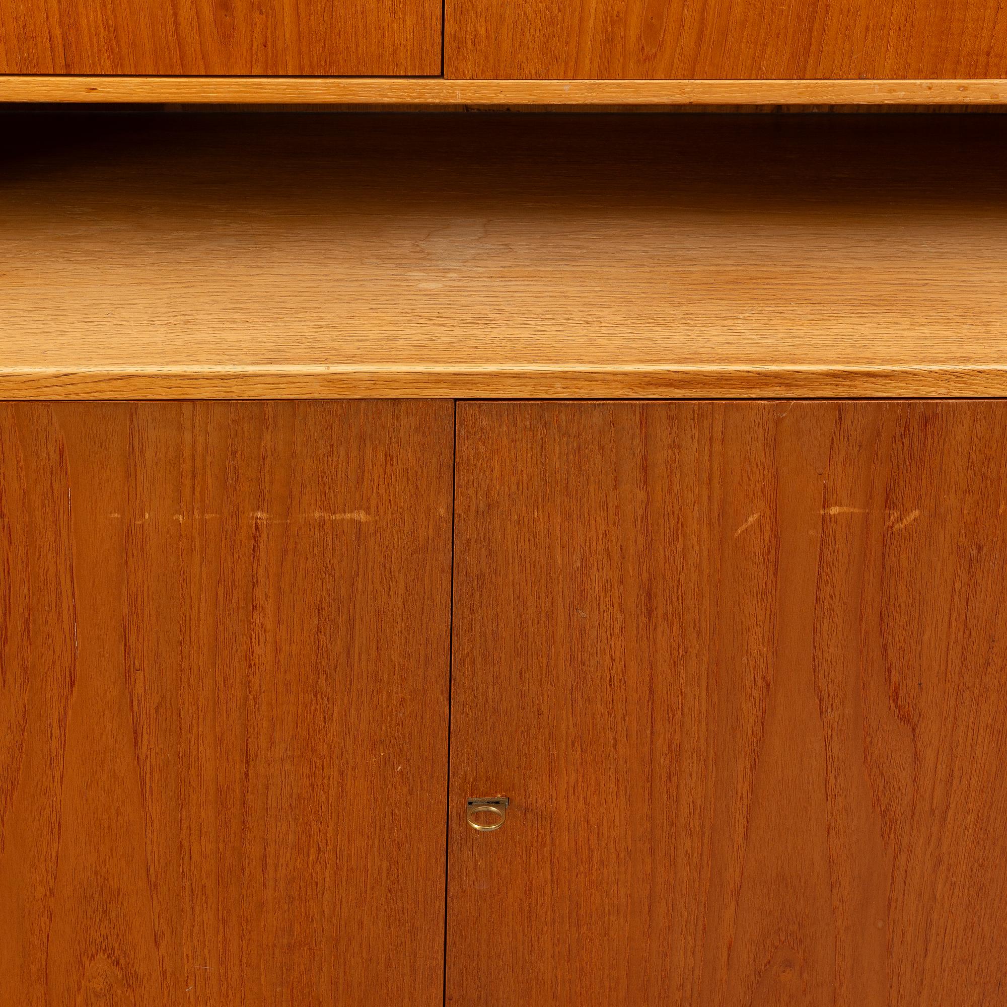 Hans J. Wegner, 2 cabinets and a shelf with a writing flap, Ry furniture, dated 1957.