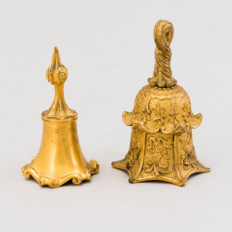 TWO TABLE BELLS, gilt bronze, second half of the 19th century.