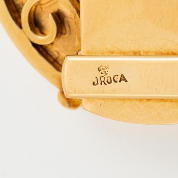 A bracelet gold set with mexican gold coins.