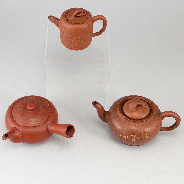 A group of three yixing pots, 20th century.