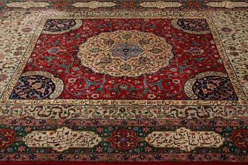 A carpet, semi-antique Tabriz, signed ca 335,5 x 256,5 - 261,5 cm.