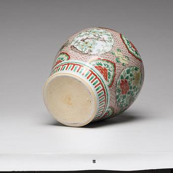 A Transitional wucai baluster vase with cover, 17th Century.